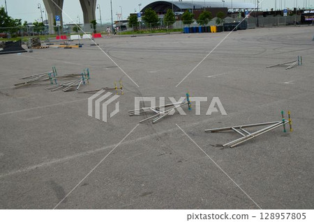 A Steel Framework Has Been Left Abandoned in the Parking Area of the Construction Site 128957805