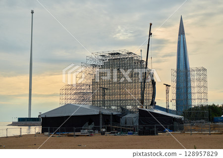 Scaffolding Structure Located Near a Contemporary Modern Skyscraper in the City 128957829