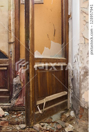 An Abandoned Door Set in a Deeply Decaying and Deteriorating Environment Full of Intrigue An Abandoned Door Set in a Deeply Decaying and Deteriorating Environment Full of Intrigue 128957941