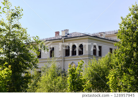 An Abandoned Grand Mansion that is Enveloped by Lush, Vibrant Greenery and Natures Beauty An Abandoned Grand Mansion that is Enveloped by Lush, Vibrant Greenery and Natures Beauty 128957945