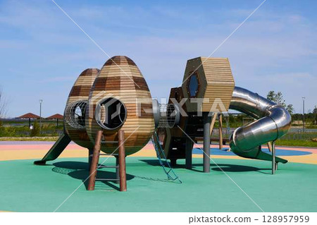 Explore innovative playground equipment with vibrant geometric designs for kids outdoor play 128957959