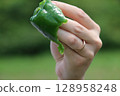 Water dripping from freshly picked peppers 128958248
