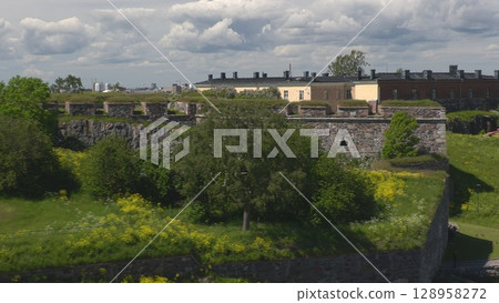 Helsinki.Finland-June 16.2021: Amazing shot of the Suomenlinna sea fortress. Historical architecture. Awesome nature. Popular tourist spot.  128958272