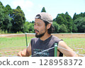 A man talking about Manganji peppers in Yachimata, Chiba Prefecture 128958372