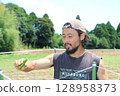 A man talking about Manganji peppers in Yachimata, Chiba Prefecture 128958373