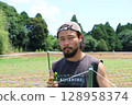 A young male farmer speaks in Yachimata City, Chiba Prefecture 128958374