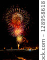 Fireworks blooming in the night sky 128958618