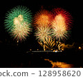 Fireworks blooming in the night sky 128958620