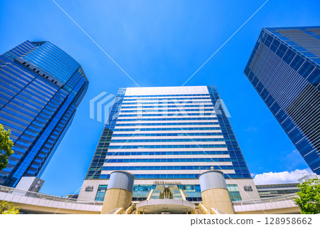 Tokyo cityscape in Japan, overlooking Shinagawa Station and office buildings, July 26th Tokyo cityscape in Japan, overlooking Shinagawa Station and office buildings, July 26th 128958662