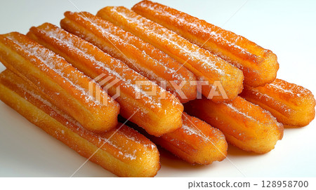 Closeup Churro isolated on white. Flying Fried churros with sugar powder. Traditional Spanish dessert 128958700