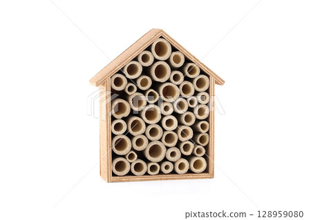 A bee house made of wood and bamboo tubes provides shelter for solitary bees. A bee house made of wood and bamboo tubes provides shelter for solitary bees. 128959080