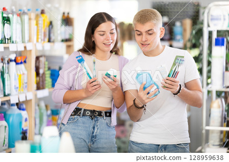 Couple man and woman choosing dental care products 128959638