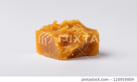 Handmade butterscotch or toffee candy showing artisanal confectionery craftsmanship 128959809
