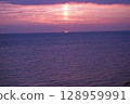 Sunset over the sea 128959991