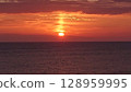Sunset over the sea 128959995