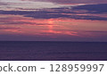 Sunset over the sea 128959997