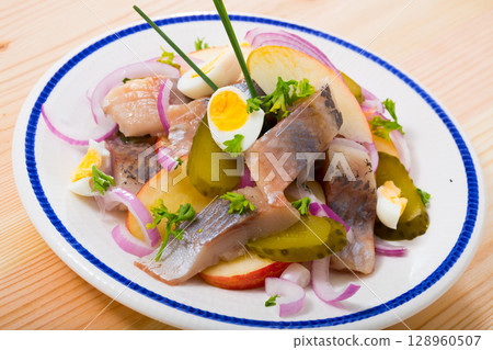Herring with apples, onion, pickles, quail egg 128960507