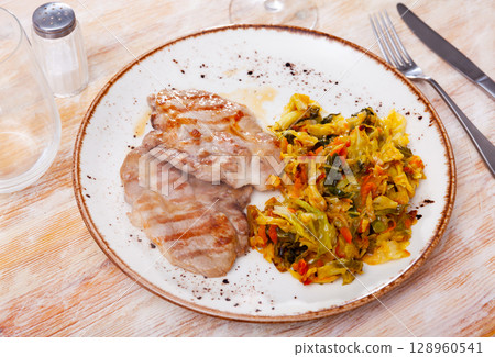 Just cooked portion of pork meat stewed with cabbage Just cooked portion of pork meat stewed with cabbage 128960541