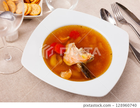 Fish soup with salmon bones and vegetables Fish soup with salmon bones and vegetables 128960740