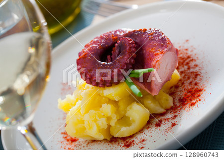 Tentacle of octopus with potatoes Tentacle of octopus with potatoes 128960743