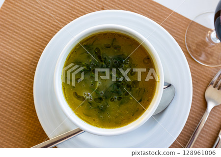 Caldo Verde soup, dish of Portuguese cuisine Caldo Verde soup, dish of Portuguese cuisine 128961006