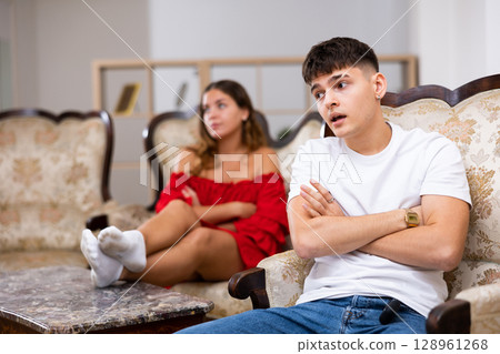 Portrait of a young couple offended by each other after a quarrel 128961268