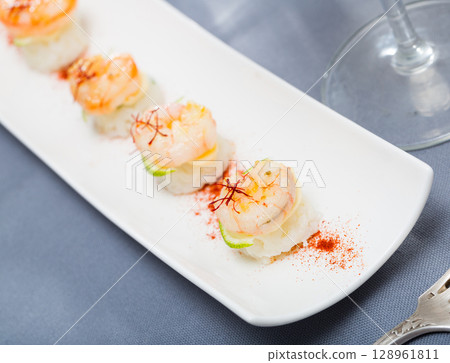 Grilled shrimps on rice with lime and saffron Grilled shrimps on rice with lime and saffron 128961811