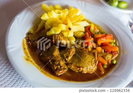 Appetizing baked pork cheeks Appetizing baked pork cheeks 128962356