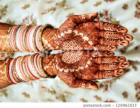 Bridal mehndi - Henna tattoo on women hands. Bridal mehndi - Henna tattoo on women hands. 128962833