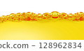 Oil surface and ripple background. orange summer drink with bubbles. oil close up. 128962834