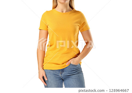 Woman models a bright yellow t-shirt with jeans, isolated on white, PNG 128964667