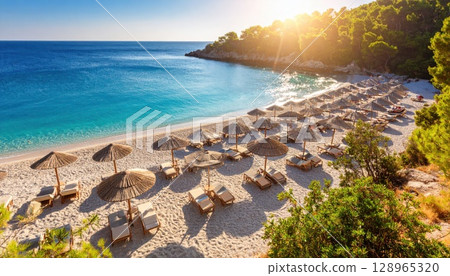 AI image: Image of a beach resort with parasols set up 128965320