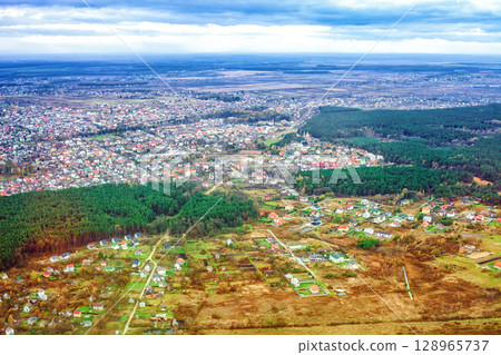 Aerial view of autumn Rudno village, church Vladimir the Great and fields in Ukraine 128965737