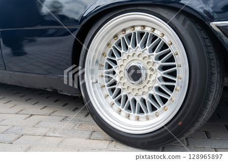 Close-Up of Custom Car Wheel and Tire Excellence.  128965897