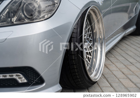 Close-Up of Custom Car Wheel and Tire Excellence.  128965902