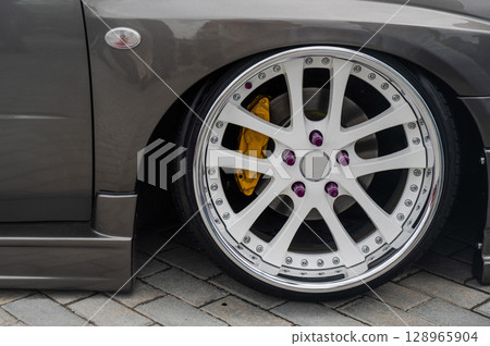 Close-Up of Custom Car Wheel and Tire Excellence.  128965904