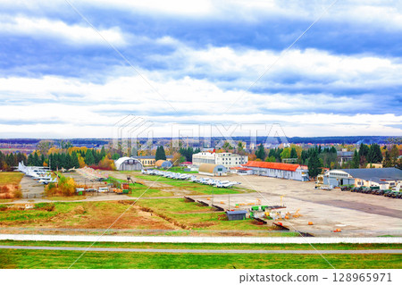Old military airfield with parked fighter planes and army cars in Lviv, Ukraine 128965971