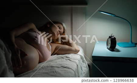 Pregnant woman suffers from insomnia.  128966638