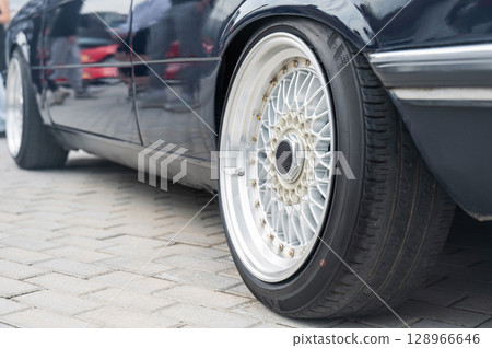Close-Up of Custom Car Wheel and Tire Excellence. Close-Up of Custom Car Wheel and Tire Excellence. 128966646