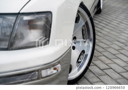 Close-Up of Custom Car Wheel and Tire Excellence.  128966650