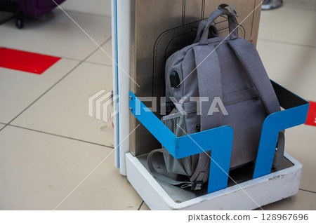 Metal frame control at the airport terminal. Checking the size of hand luggage at the airport. Metal frame control at the airport terminal. Checking the size of hand luggage at the airport. 128967696