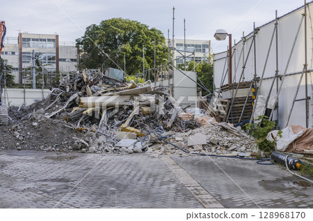 Demolition work in progress, construction site, rubble removal work Demolition work in progress, construction site, rubble removal work 128968170