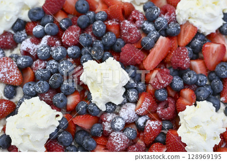 Delicious strawberry tart with blueberries, fresh raspberries and whipped cream, cheesecake, top Delicious strawberry tart with blueberries, fresh raspberries and whipped cream, cheesecake, top 128969195