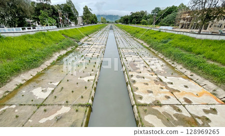 Outdoor catchwater , aqueduct construction, green grass, trees in Hong Kong Outdoor catchwater , aqueduct construction, green grass, trees in Hong Kong 128969265