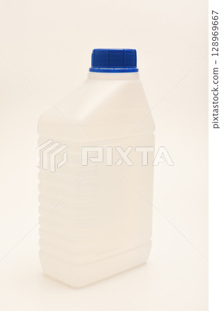 A white plastic container with a blue lid. A small plastic canister. A container with liquid. 128969667