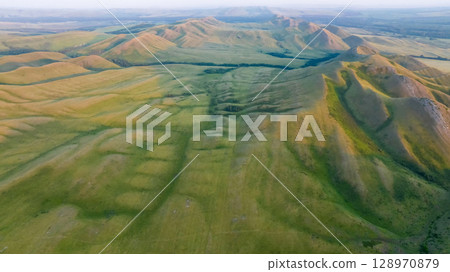 Hills stretching into the distance. Orenburg Hills stretching into the distance. Orenburg 128970879