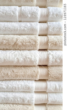 Stack of Clean White and Beige Cotton Towels in Vertical Arrangement Still Life 128971165