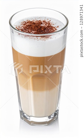 Layered Cappuccino in Tall Glass with Foamy Top and Chocolate Sprinkles on White Surface 128971341
