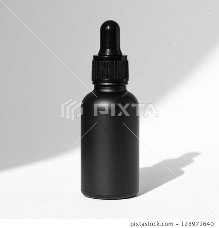Black Dropper Bottle with Essential Oil on White Seamless Background Black Dropper Bottle with Essential Oil on White Seamless Background 128971640