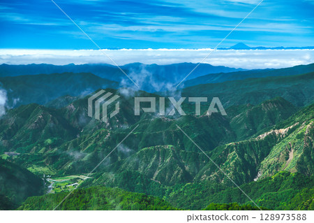 View of Ashio and Mt. Fuji in the distance from Yashiroyama in Oku-Nikko, Nikko, Tochigi Prefecture 128973588